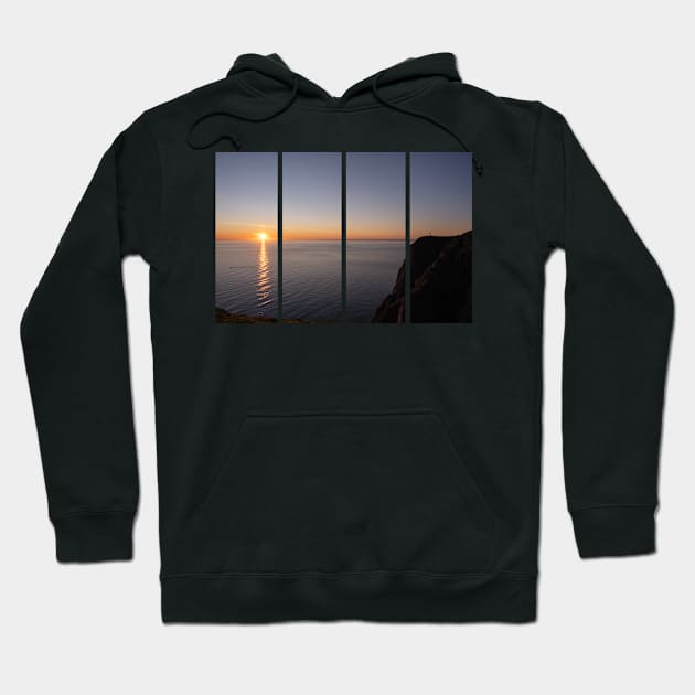 Wonderful landscapes in Norway. Nord-Norge. Beautiful scenery of a midnight sun sunset at Nordkapp (Cape North). Boat and globe on a cliff. Rippled sea and clear orange sky. Hoodie by fabbroni-art